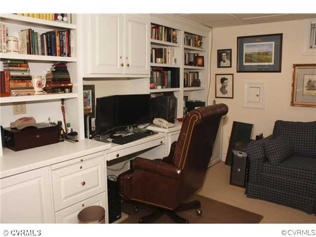 9100 River Road Henrico, VA 23229 - Photo 18 of 24 a living room with furniture fireplace and book shelf