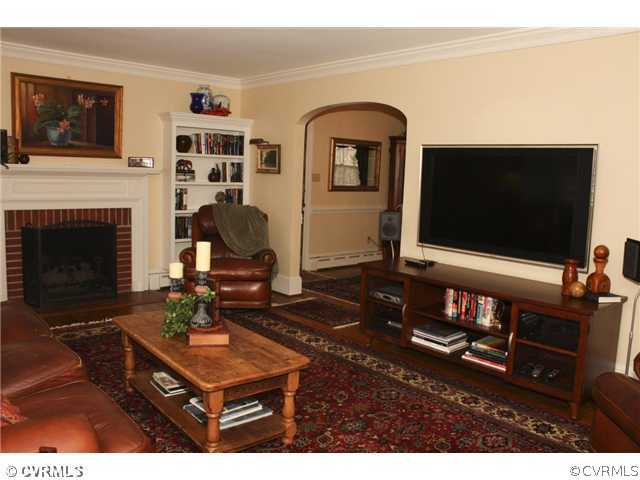 9100 River Road Henrico, VA 23229 - Photo 3 of 24 a living room with furniture a flat screen tv and a fireplace