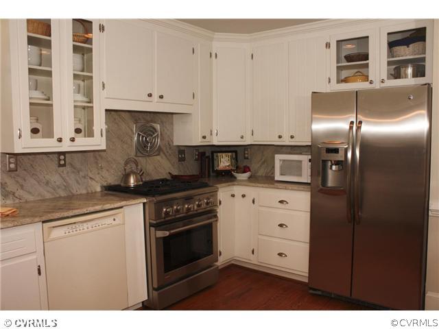 9100 River Road Henrico, VA 23229 - Photo 9 of 24 a kitchen with stainless steel appliances granite countertop a stove a sink and a refrigerator