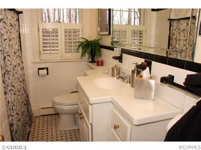 9100 River Road Henrico, VA 23229 - Photo 10 of 24 a bathroom with a sink toilet and shower