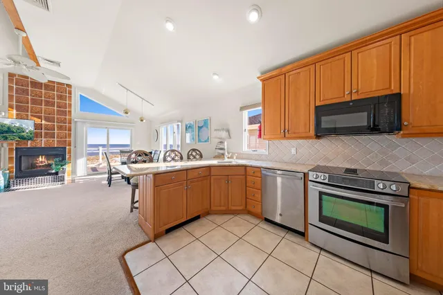 a kitchen with a sink cabinets and stainless steel appliances