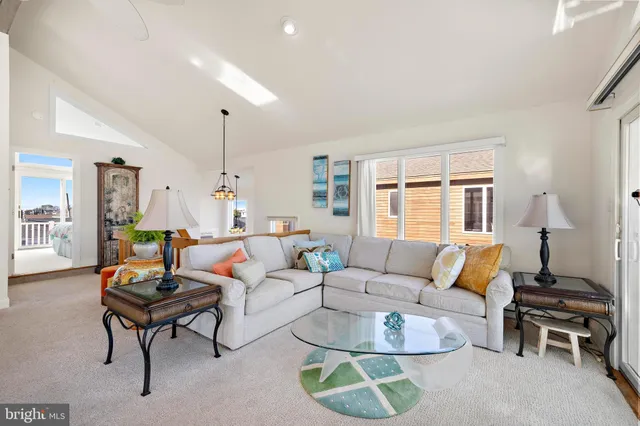 a living room with furniture and a table