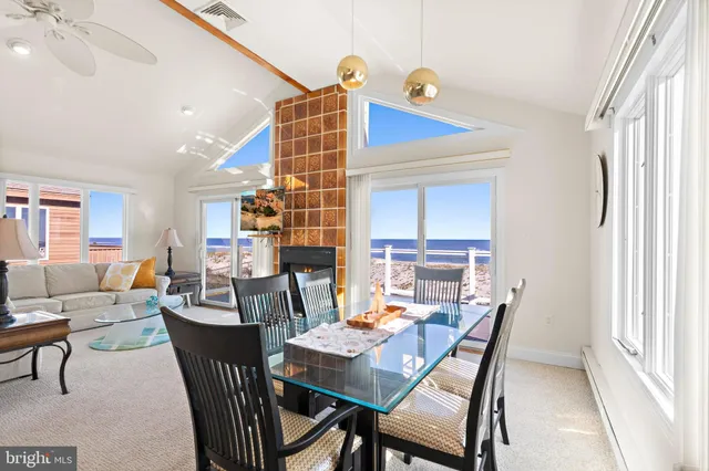 a view of a dining room with furniture and a window
