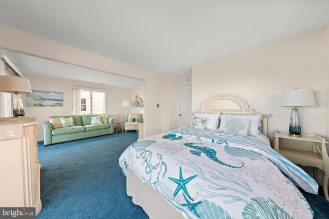 a bedroom with bed and window