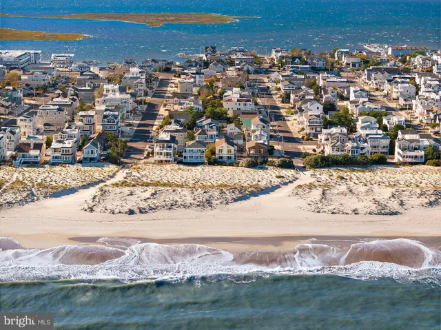 an aerial view of a house with a lake view