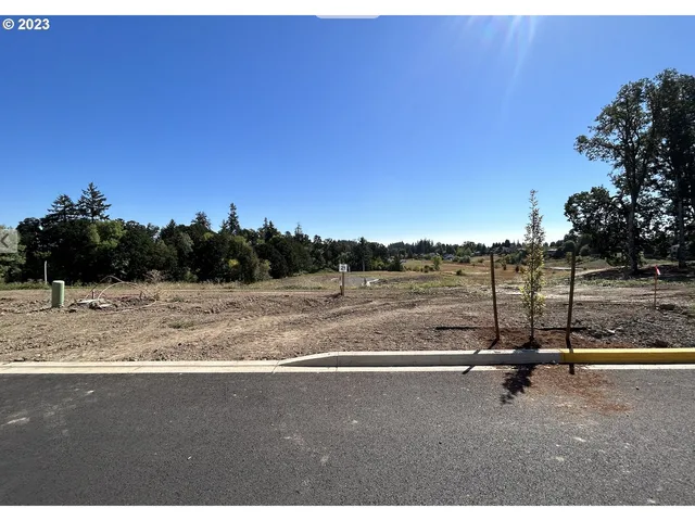 a picture of a book and a white bed