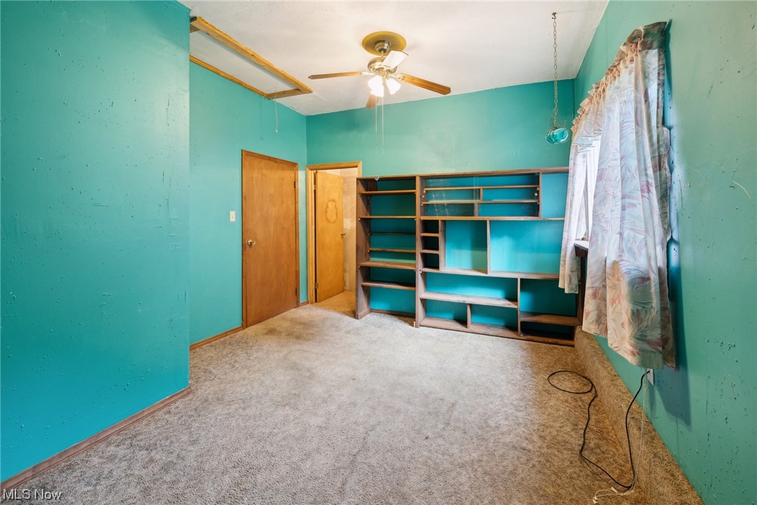 2715 Douglas Road Ashtabula, OH 44004 - Photo 31 of 34 Spare room featuring light carpet and ceiling fan