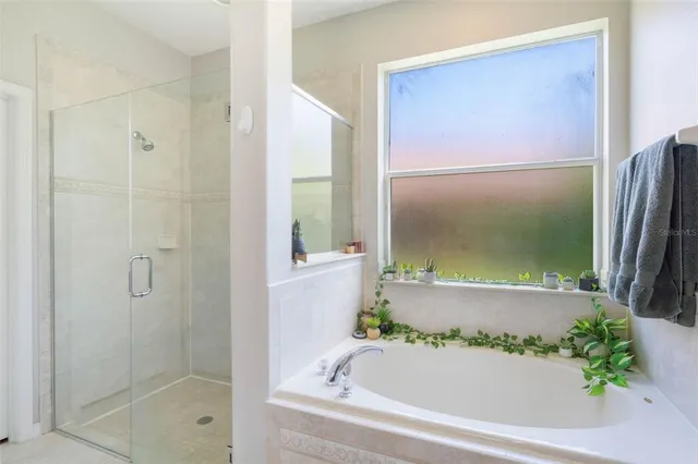 a bathroom with a bathtub and shower