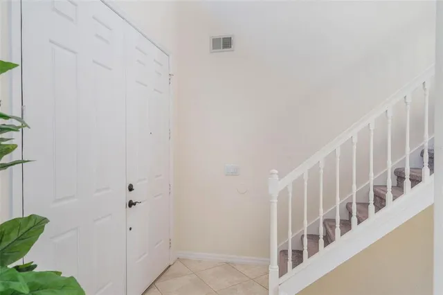 a view of staircase with white walls