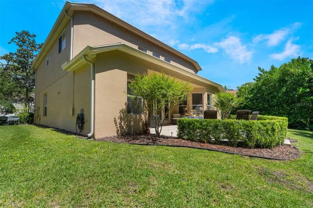 a front view of house with a garden