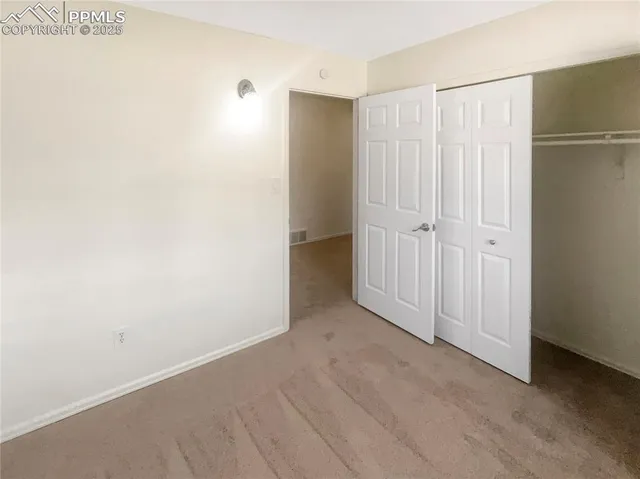 a white toilet sitting next to a bath tub