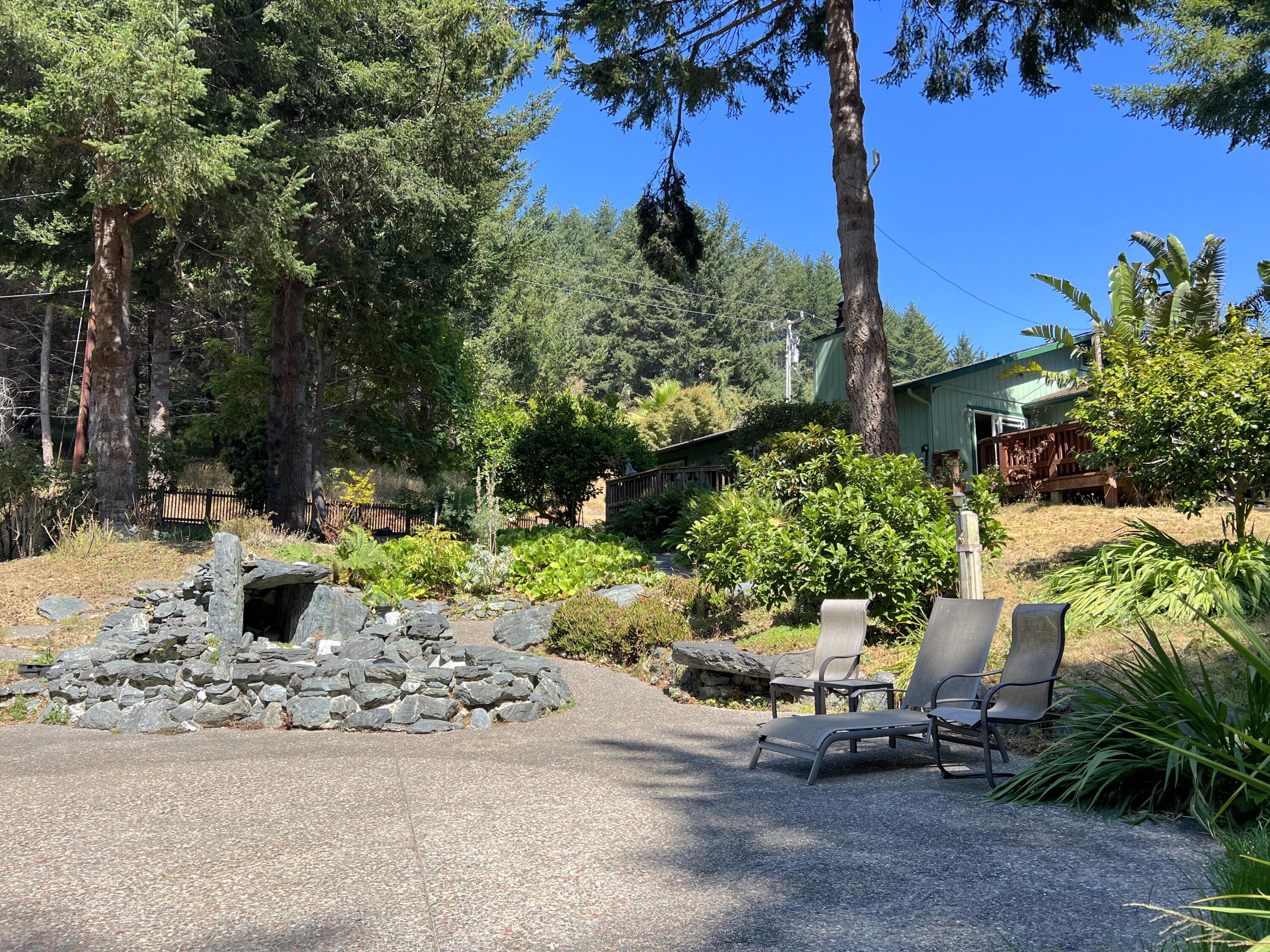 482 Spring Road Shelter Cove, CA 95589 - Photo 33 of 58 Patio pond to house