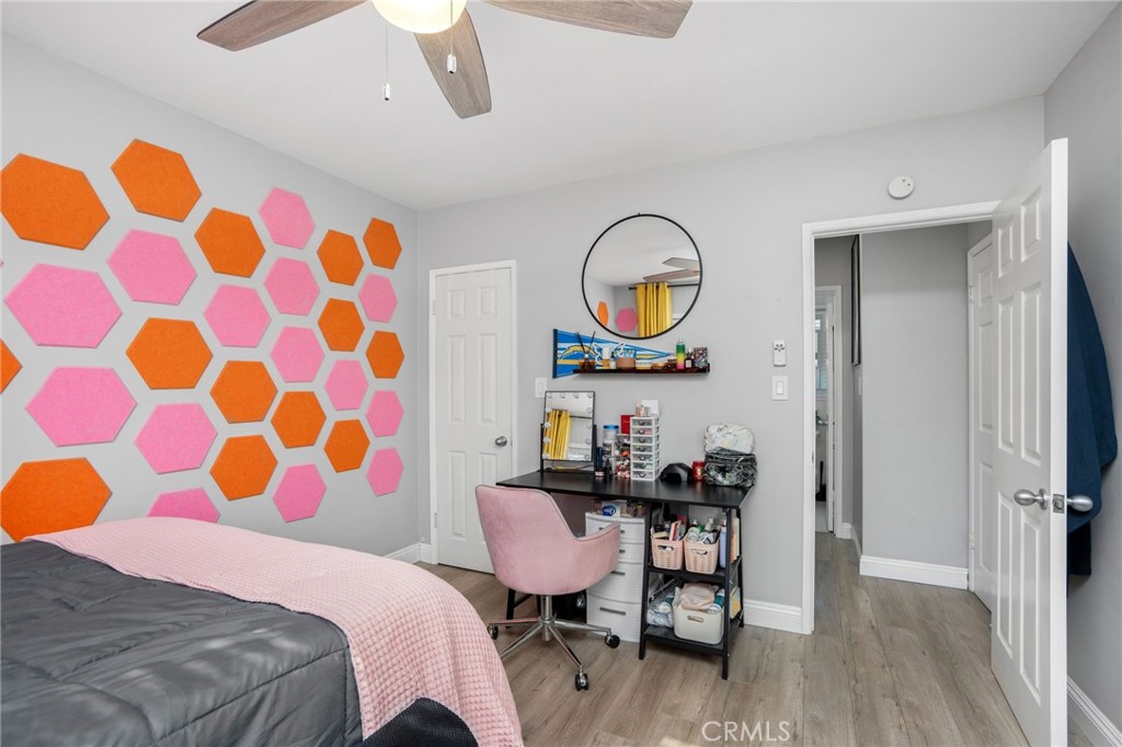 257 5th Street Seal Beach, CA 90740 - Photo 13 of 49 a bedroom that has a bed and a chair in it