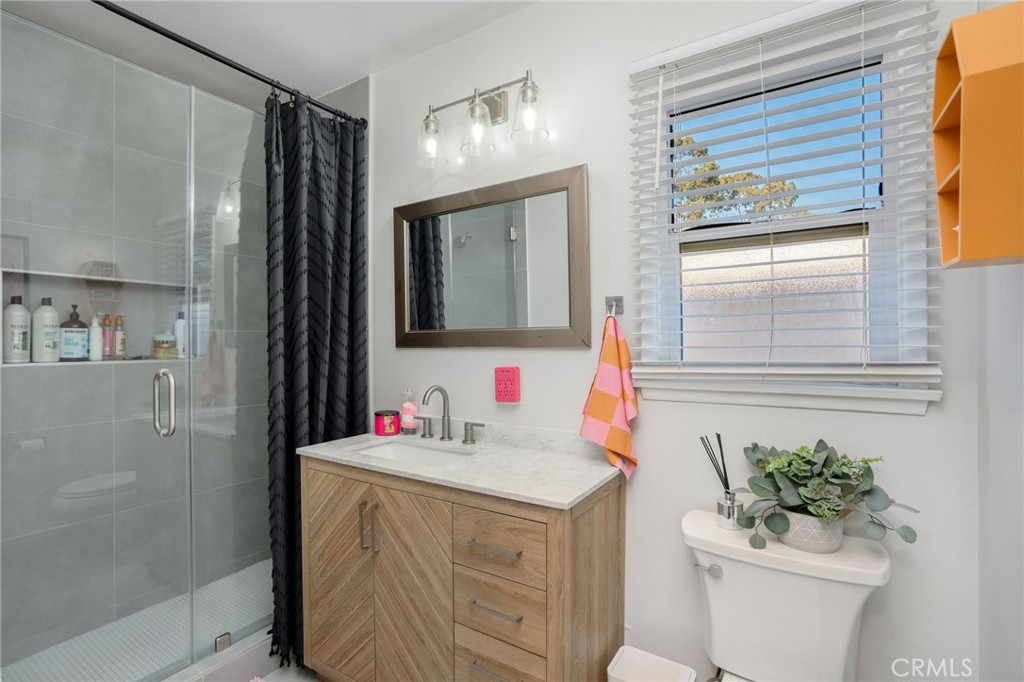 257 5th Street Seal Beach, CA 90740 - Photo 14 of 49 a bathroom with a sink toilet and shower