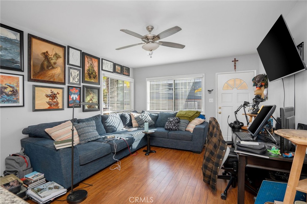 257 5th Street Seal Beach, CA 90740 - Photo 16 of 49 a living room with furniture and a flat screen tv