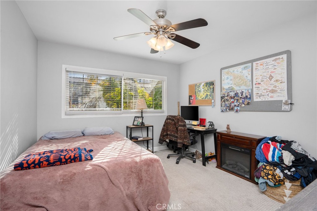 257 5th Street Seal Beach, CA 90740 - Photo 20 of 49 a bedroom with furniture and a window