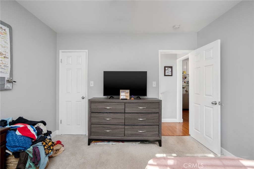 257 5th Street Seal Beach, CA 90740 - Photo 21 of 49 a living room with furniture and a dresser