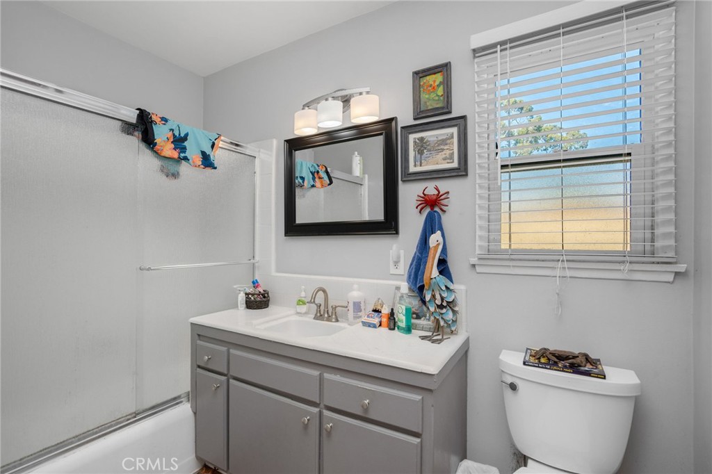 257 5th Street Seal Beach, CA 90740 - Photo 22 of 49 a bathroom with a sink and a mirror
