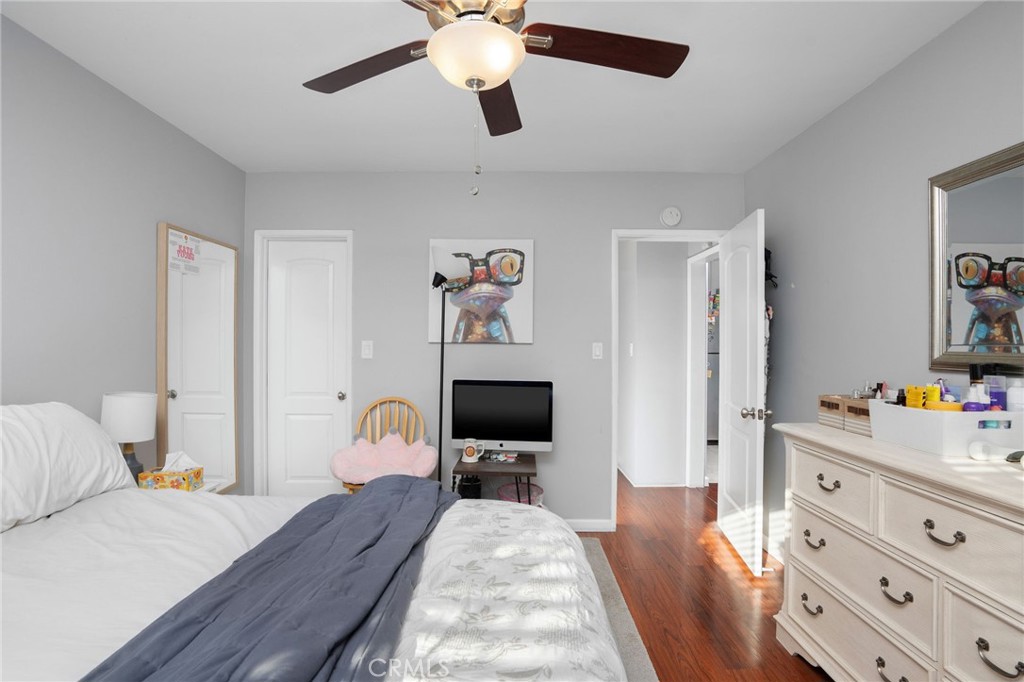 257 5th Street Seal Beach, CA 90740 - Photo 29 of 49 a bedroom with a bed and a flat screen tv