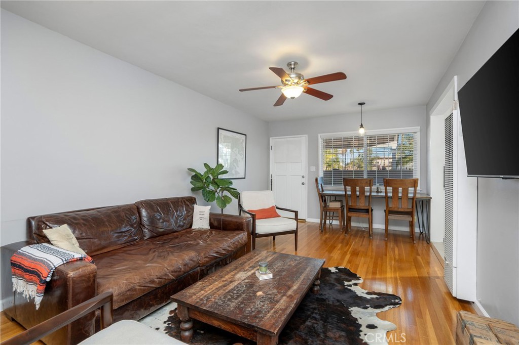 257 5th Street Seal Beach, CA 90740 - Photo 31 of 49 a living room with furniture wooden floor and a flat screen tv