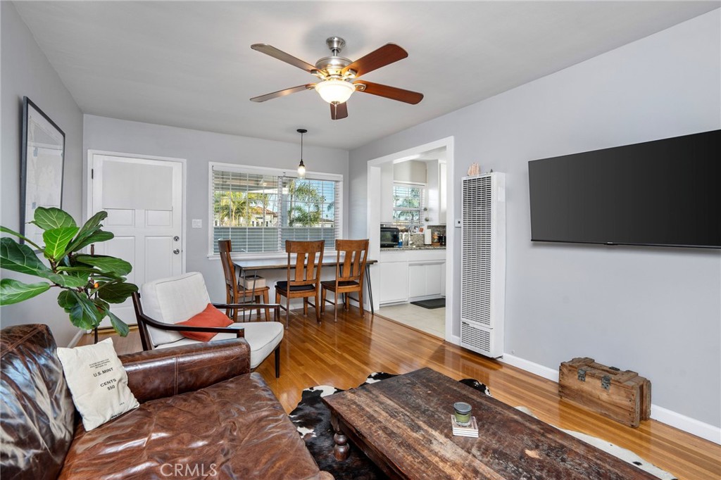 257 5th Street Seal Beach, CA 90740 - Photo 32 of 49 a living room with furniture and a flat screen tv