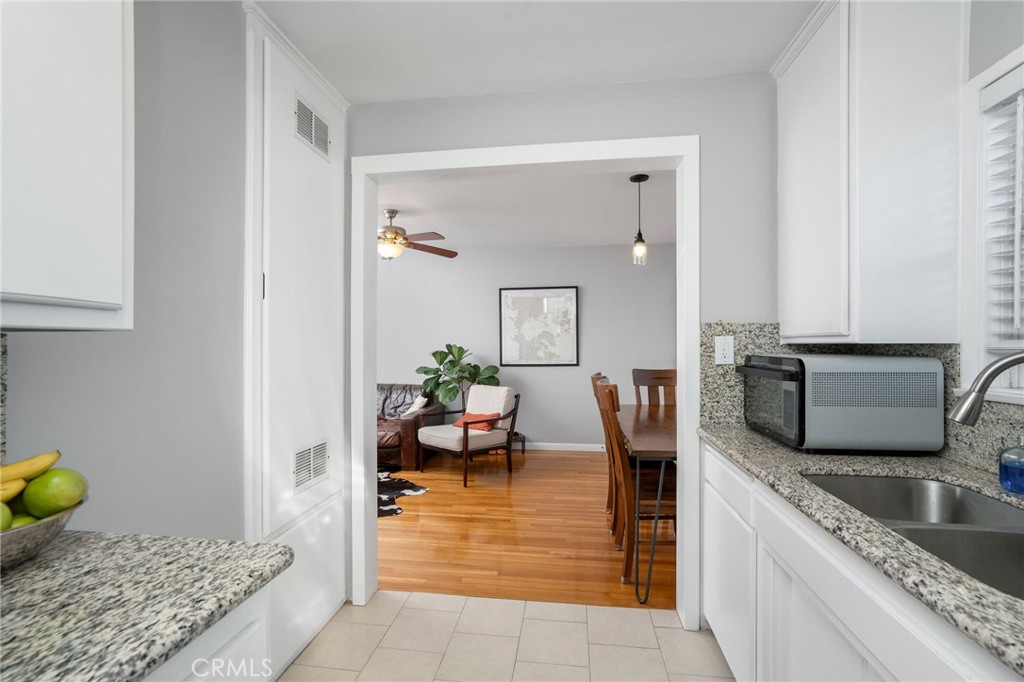 257 5th Street Seal Beach, CA 90740 - Photo 36 of 49 a kitchen with stainless steel appliances granite countertop a sink and a granite counter tops