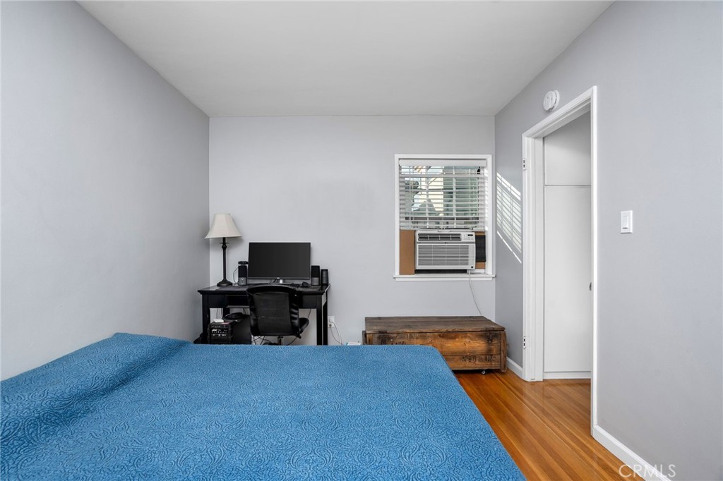 257 5th Street Seal Beach, CA 90740 - Photo 39 of 49 a bedroom with bed and window