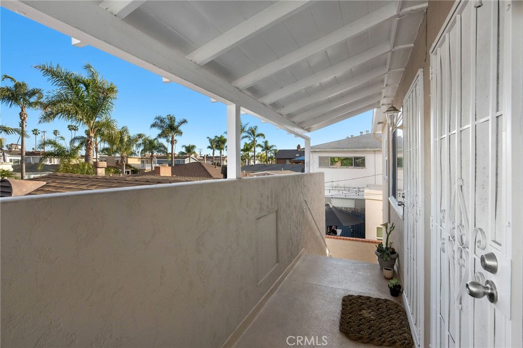 257 5th Street Seal Beach, CA 90740 - Photo 41 of 49 a view of a living room and entryway with furniture