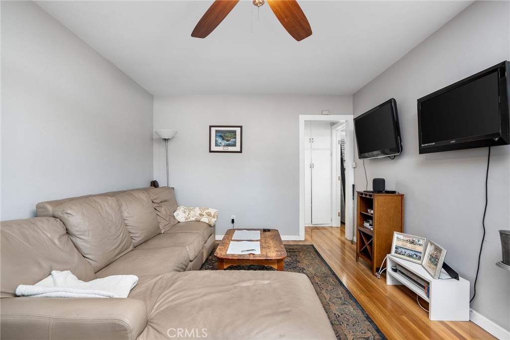 257 5th Street Seal Beach, CA 90740 - Photo 45 of 49 a living room with furniture and a flat screen tv