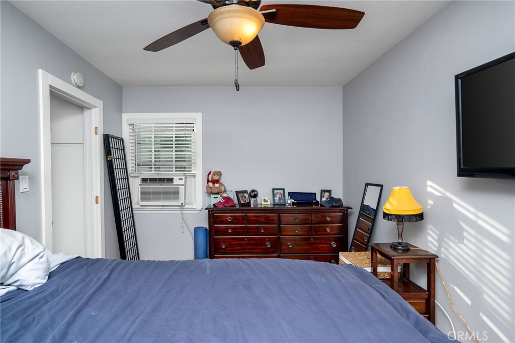 257 5th Street Seal Beach, CA 90740 - Photo 47 of 49 a bedroom with a bed and furniture