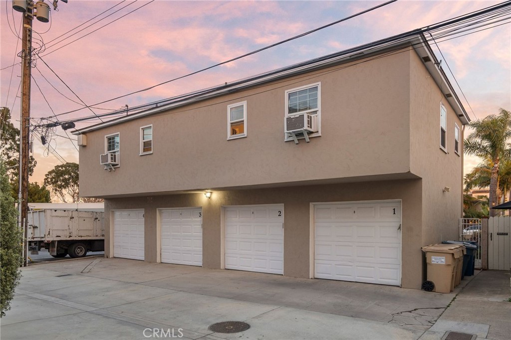 257 5th Street Seal Beach, CA 90740 - Photo 6 of 49 a front view of a house with garage