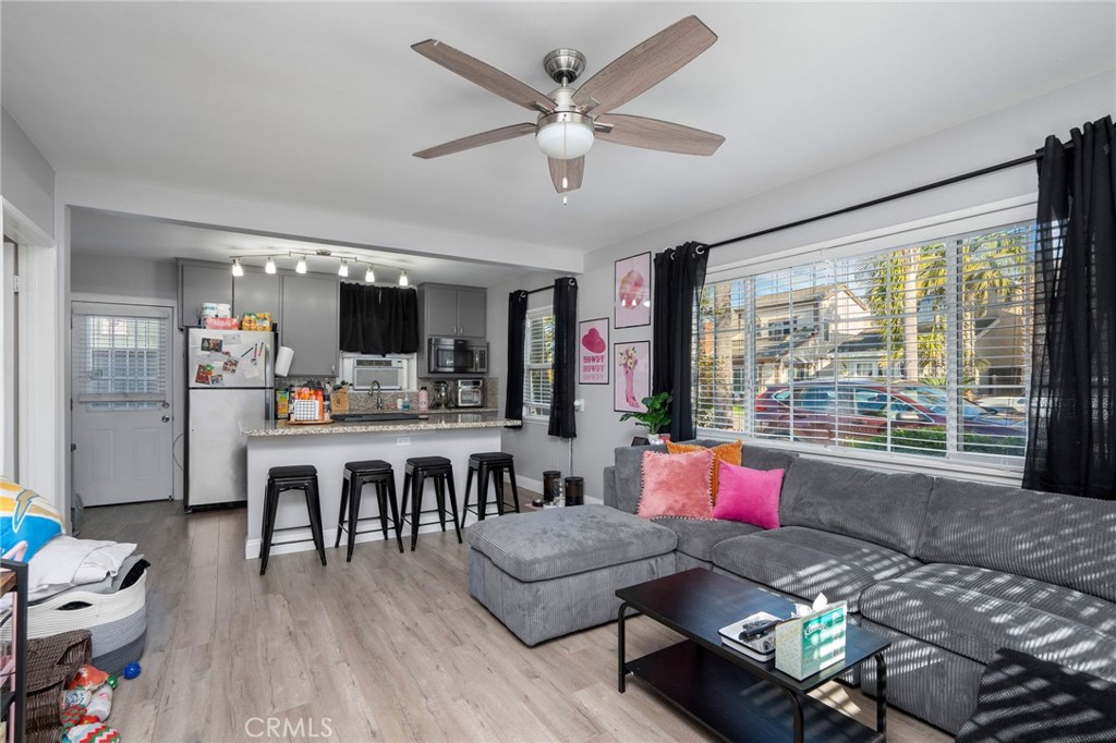 257 5th Street Seal Beach, CA 90740 - Photo 7 of 49 a living room with furniture and outdoor view