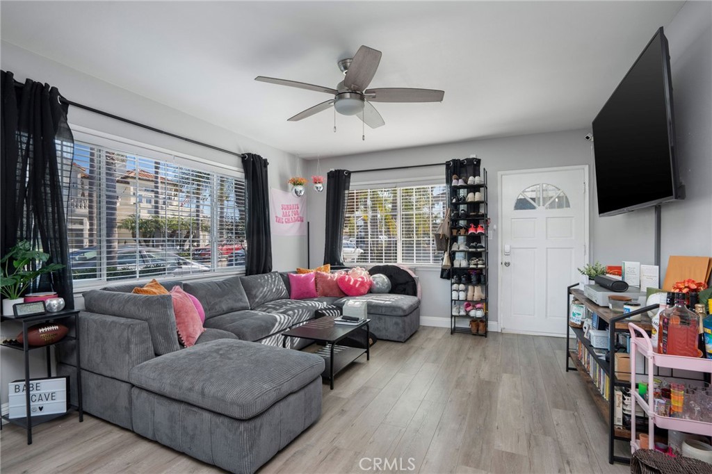 257 5th Street Seal Beach, CA 90740 - Photo 8 of 49 a living room with furniture and a flat screen tv