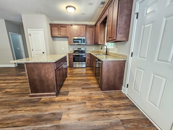 3177 Rodgers Creek Road Ellijay, GA 30540 - Photo 8 of 31 a kitchen with stainless steel appliances granite countertop a stove top oven a sink a refrigerator and cabinets
