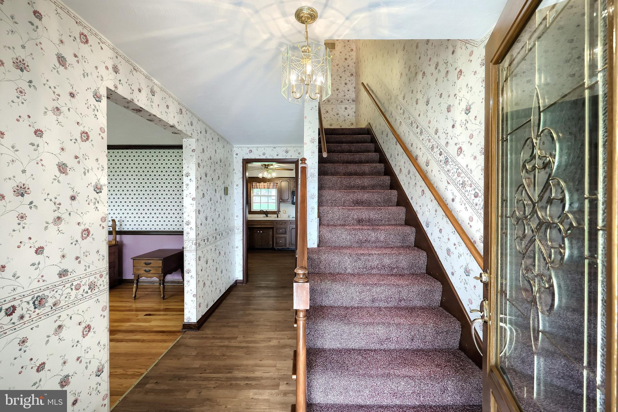 358 Three Hill Road Spring Grove, PA 17362 - Photo 20 of 50 a view of a hallway with wooden floor and staircase