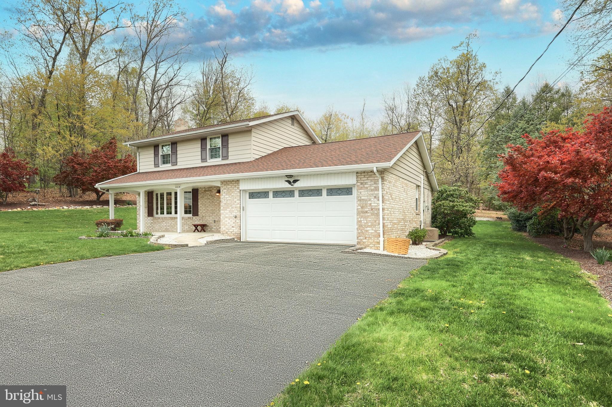 358 Three Hill Road Spring Grove, PA 17362 - Photo 2 of 50 a front view of a house with a garden and yard