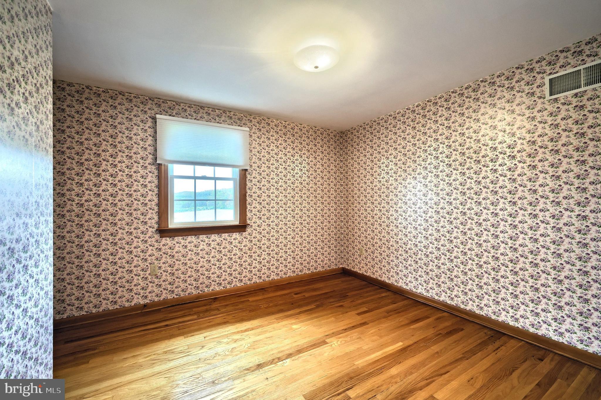 358 Three Hill Road Spring Grove, PA 17362 - Photo 29 of 50 a view of a room with wooden floor and a window