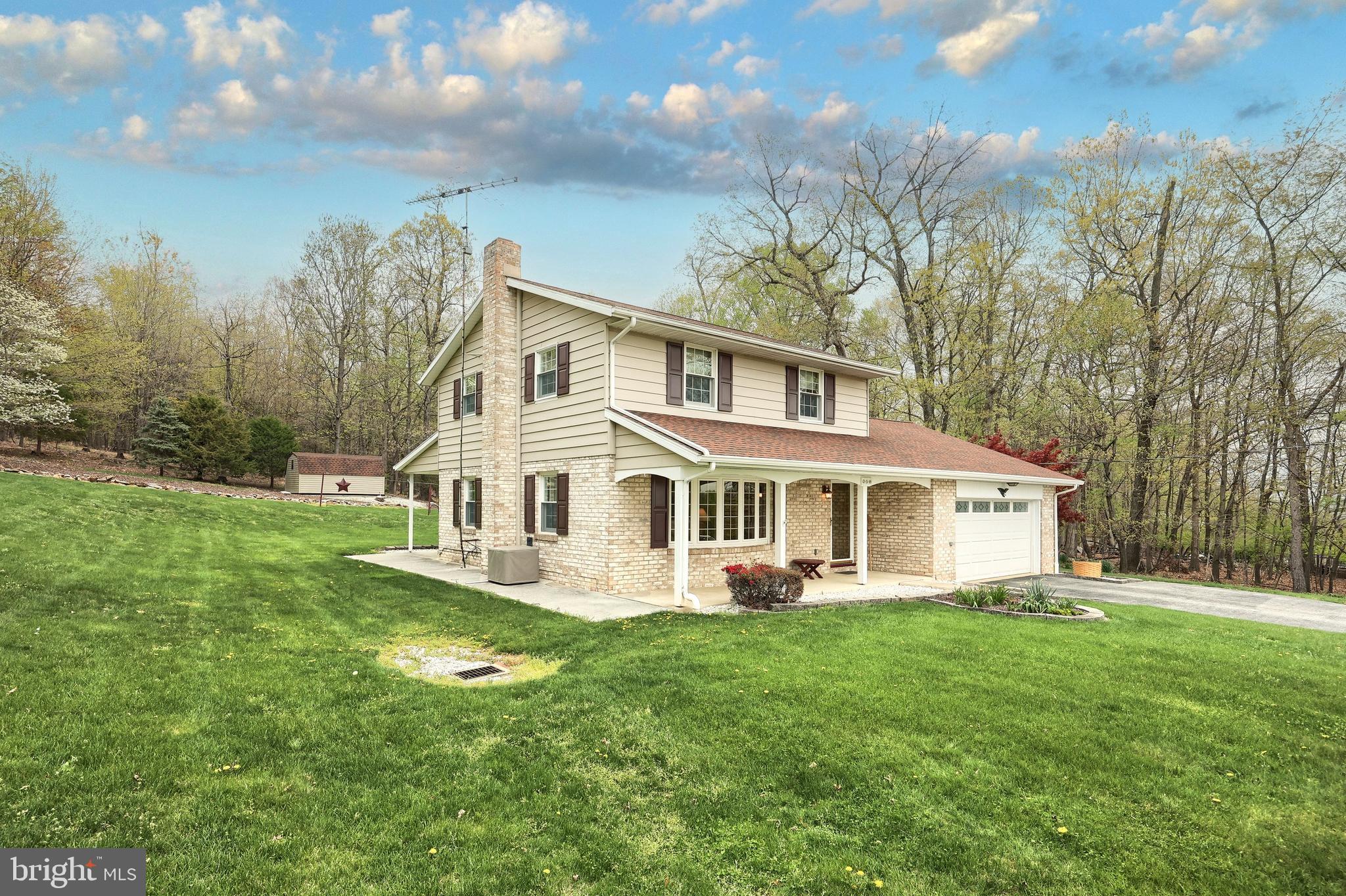 358 Three Hill Road Spring Grove, PA 17362 - Photo 38 of 50 a front view of a house with a yard table and chairs