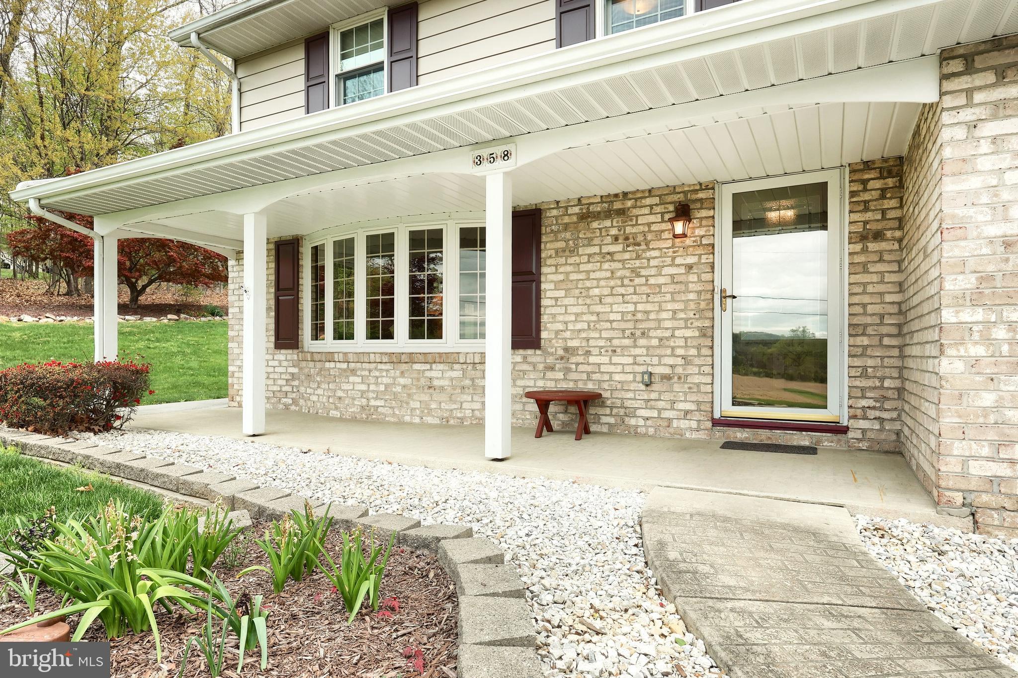 358 Three Hill Road Spring Grove, PA 17362 - Photo 5 of 50 a view of a house with a yard and sitting area