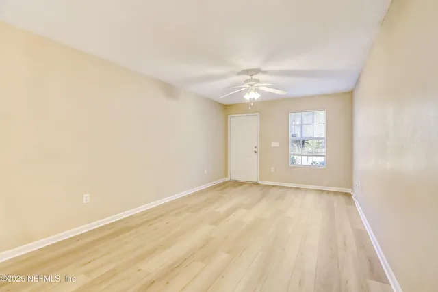 a view of an empty room with a window