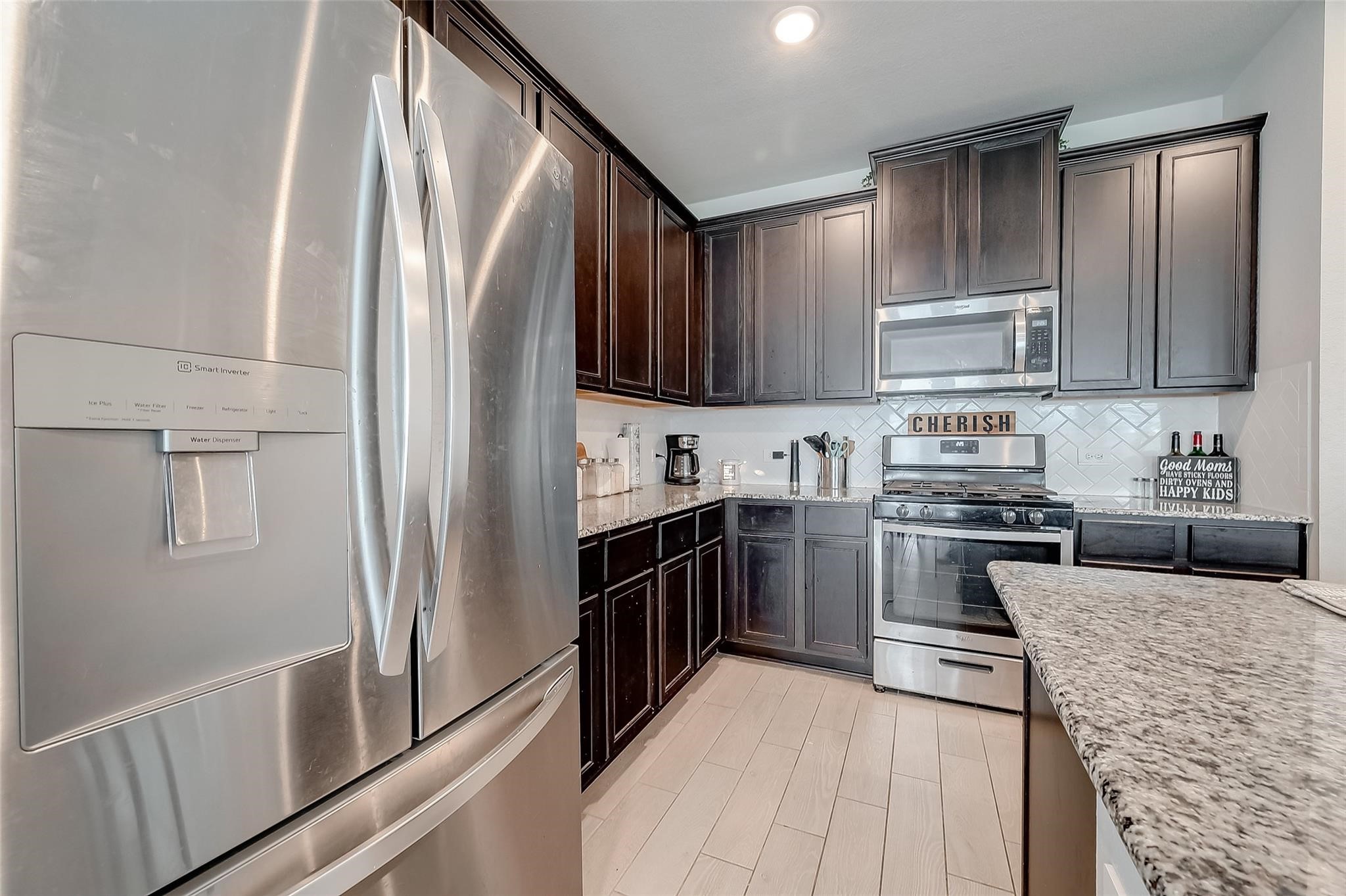 4731 Seabourne Landing Drive Rosenberg, TX 77469 - Photo 13 of 49 a kitchen with stainless steel appliances granite countertop a refrigerator sink and stove