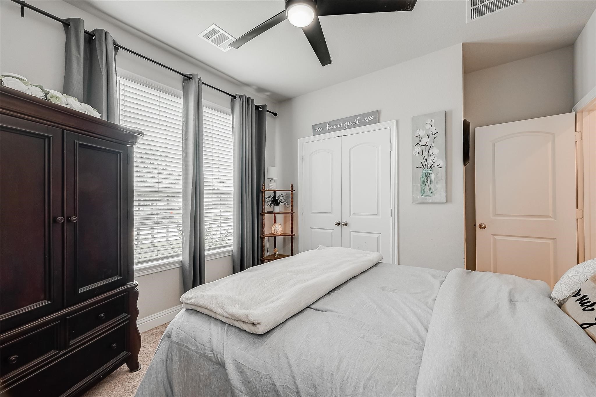 4731 Seabourne Landing Drive Rosenberg, TX 77469 - Photo 20 of 49 a bedroom with a bed dresser and a window