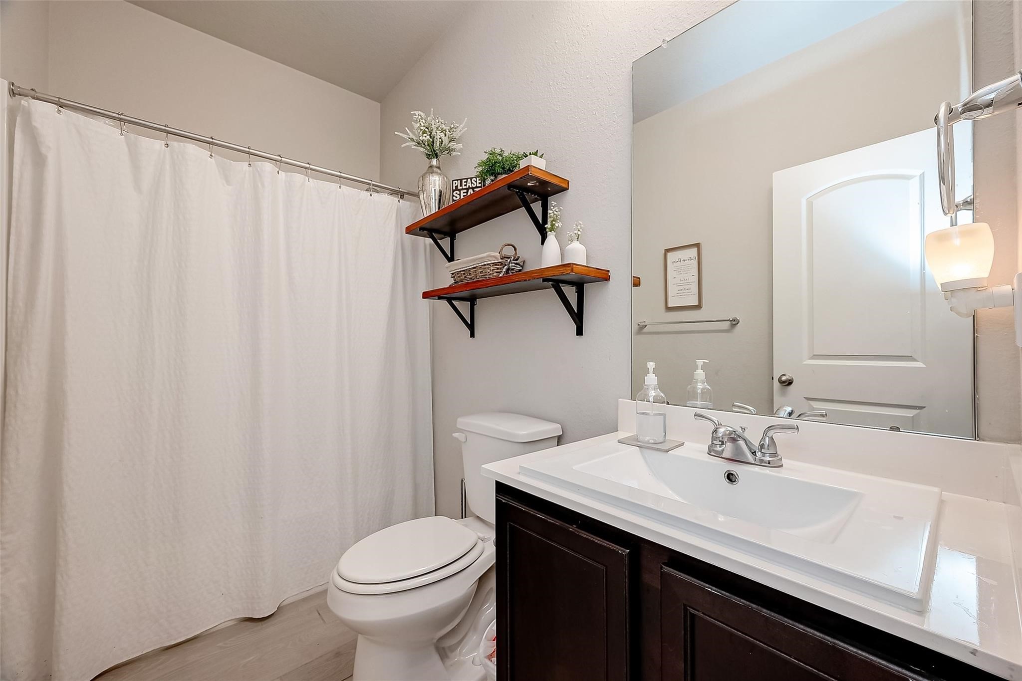4731 Seabourne Landing Drive Rosenberg, TX 77469 - Photo 21 of 49 a bathroom with a sink and mirror