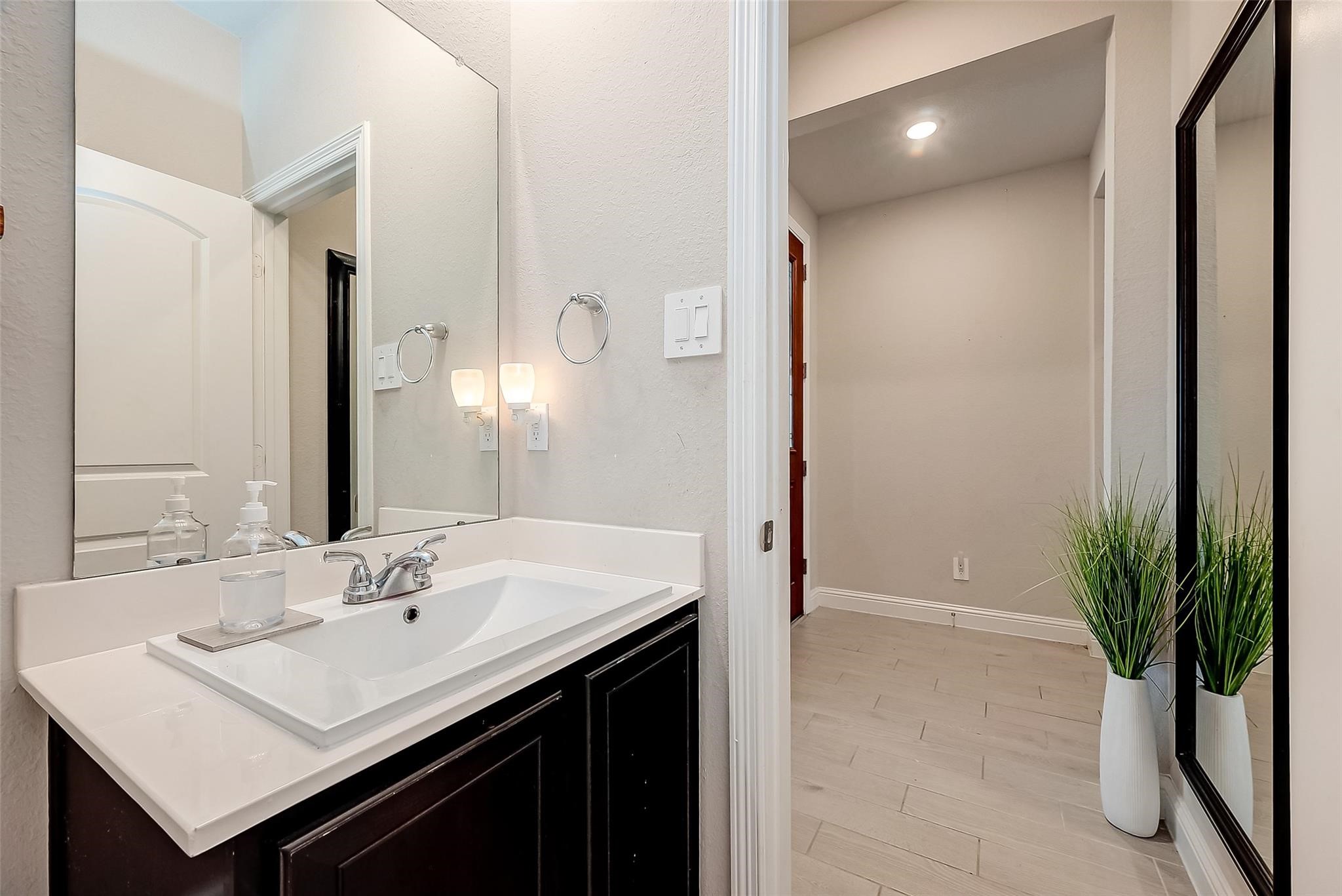 4731 Seabourne Landing Drive Rosenberg, TX 77469 - Photo 22 of 49 a bathroom with a sink and a mirror