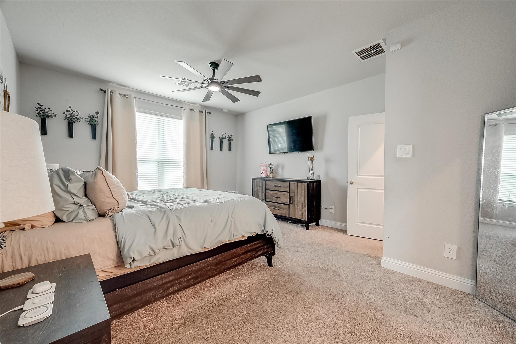 4731 Seabourne Landing Drive Rosenberg, TX 77469 - Photo 25 of 49 a spacious bedroom with a bed and a flat screen tv