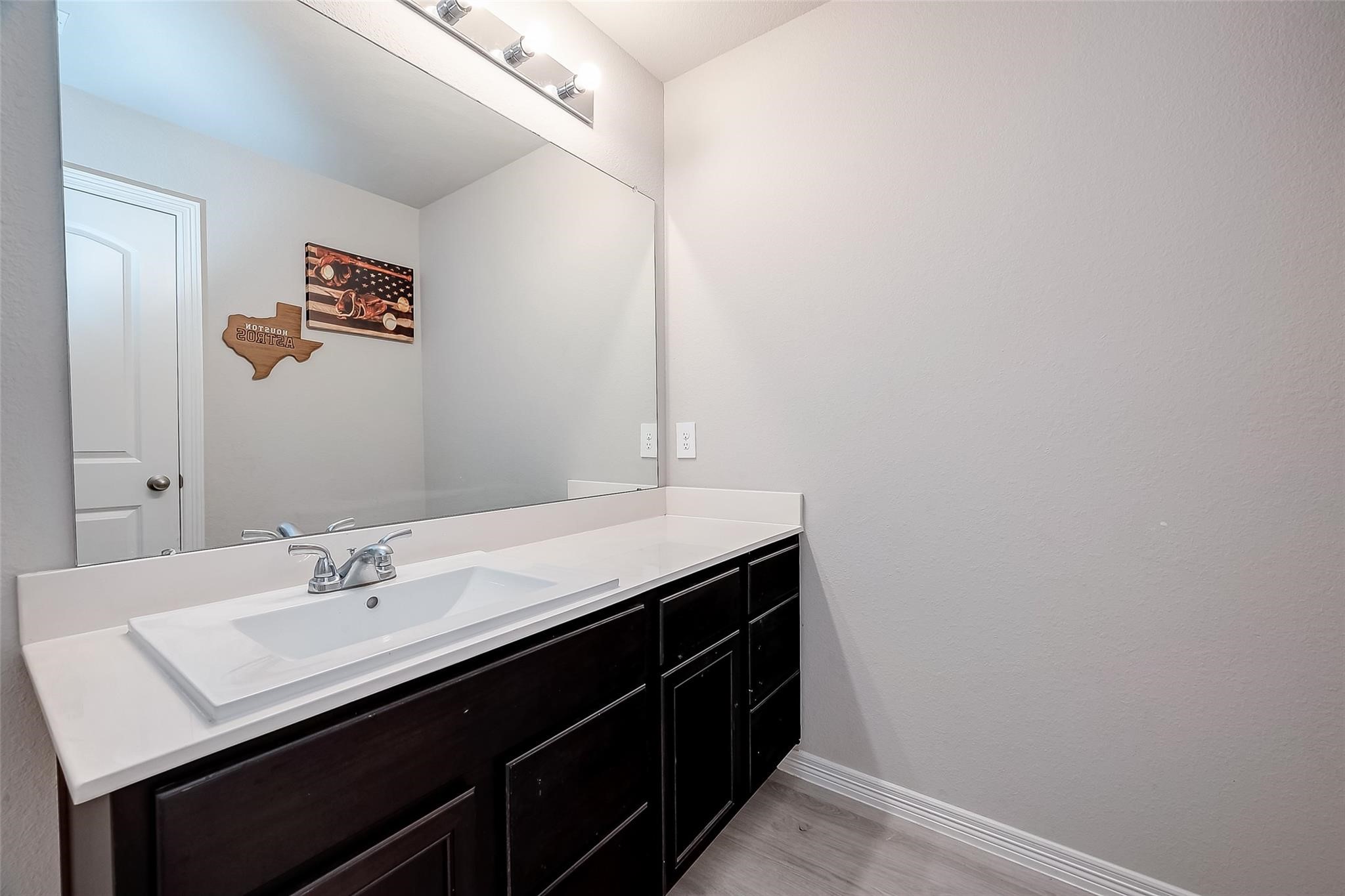 4731 Seabourne Landing Drive Rosenberg, TX 77469 - Photo 37 of 49 a bathroom with a sink and a mirror