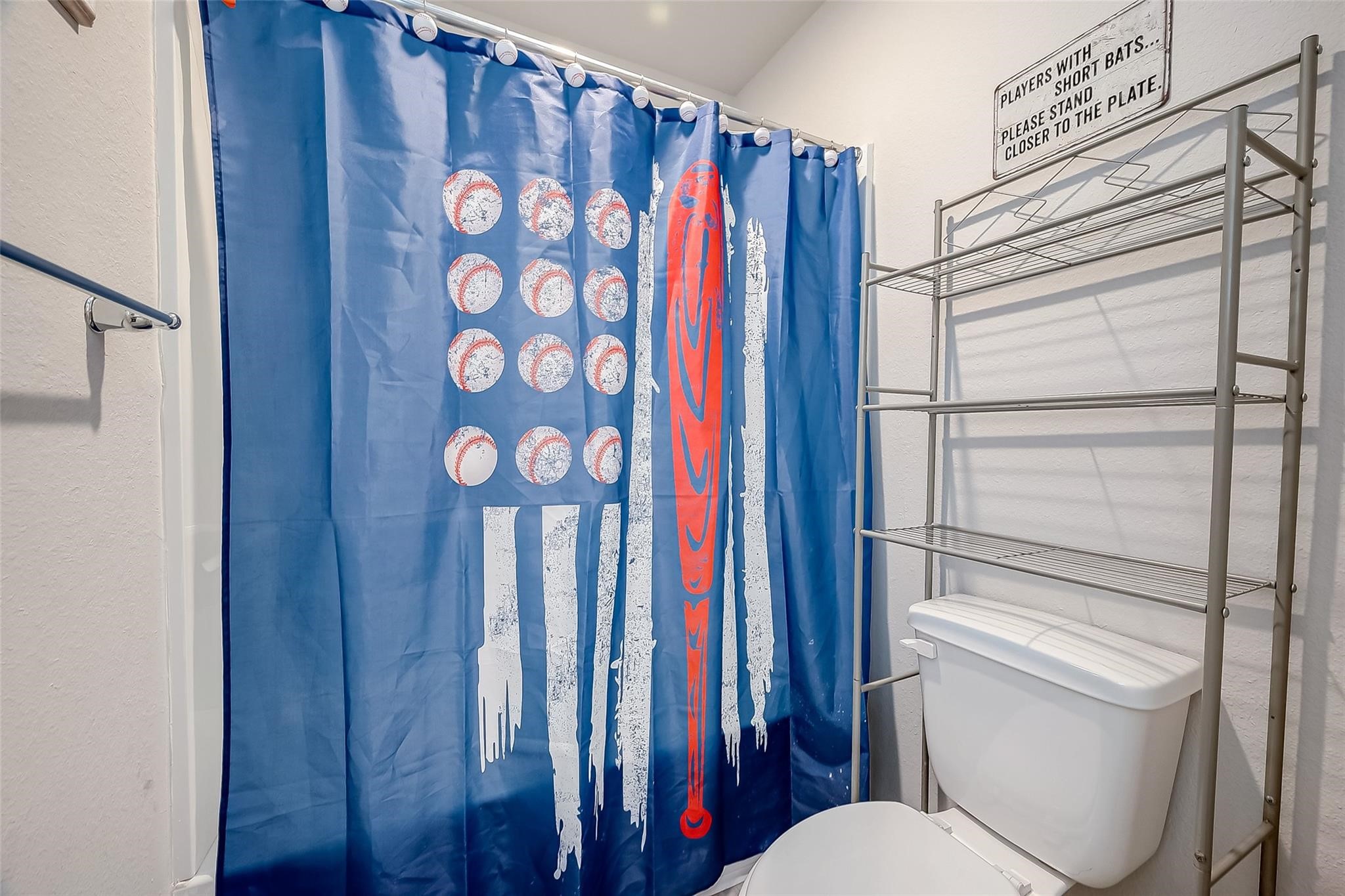 4731 Seabourne Landing Drive Rosenberg, TX 77469 - Photo 38 of 49 a bathroom with a toilet and a shower curtain