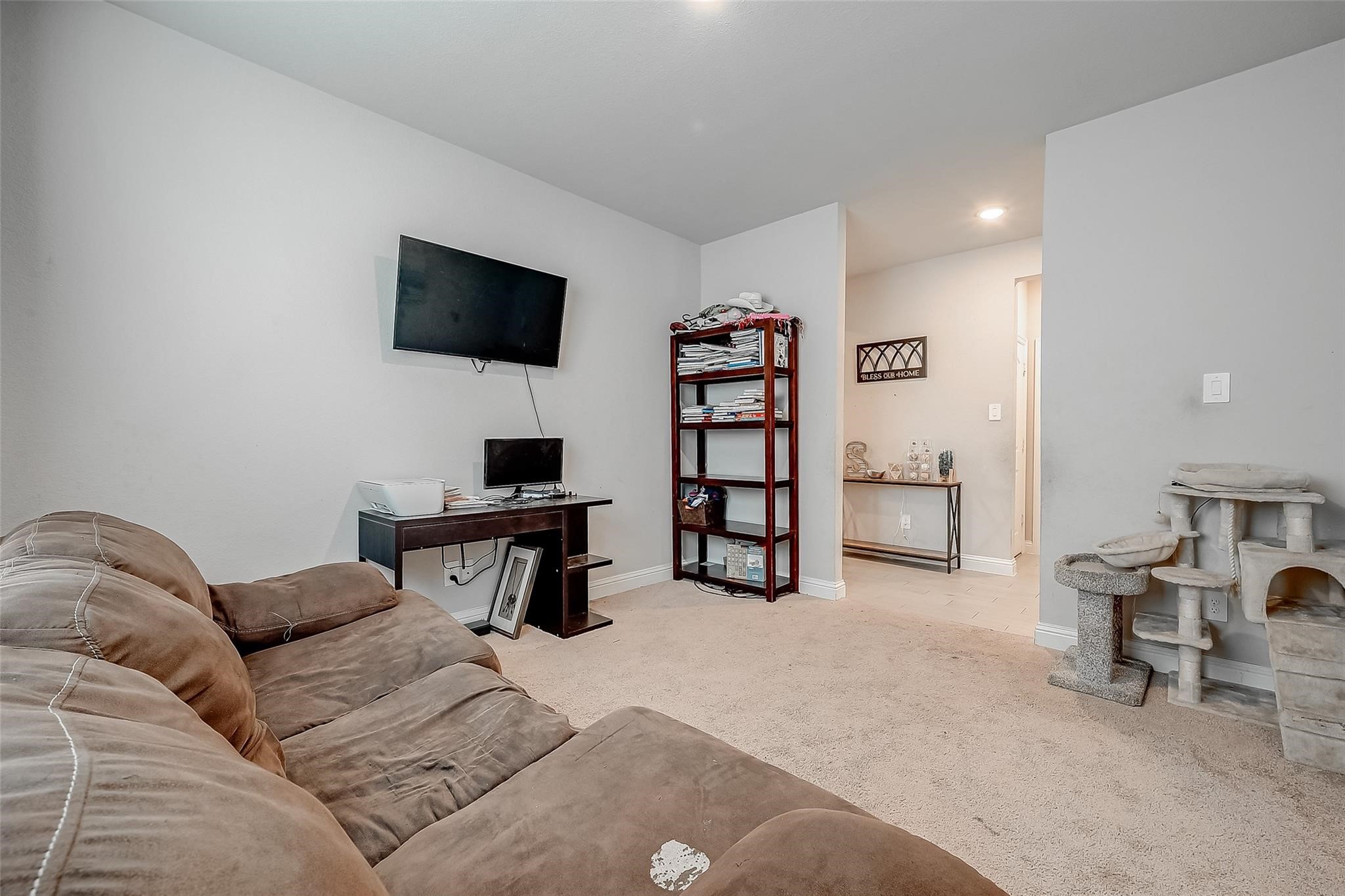 4731 Seabourne Landing Drive Rosenberg, TX 77469 - Photo 5 of 49 a living room with furniture and a flat screen tv