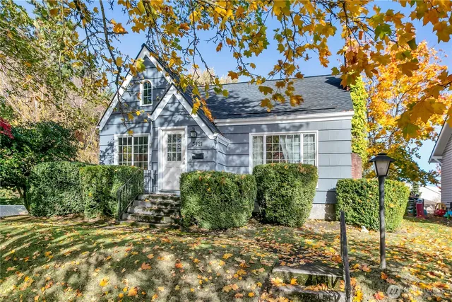 a front view of a house with a garden