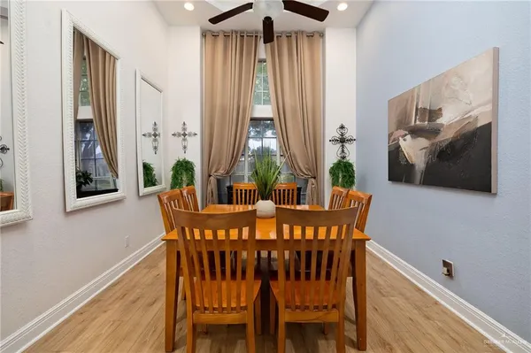 a view of a dining room with furniture window and wooden floor